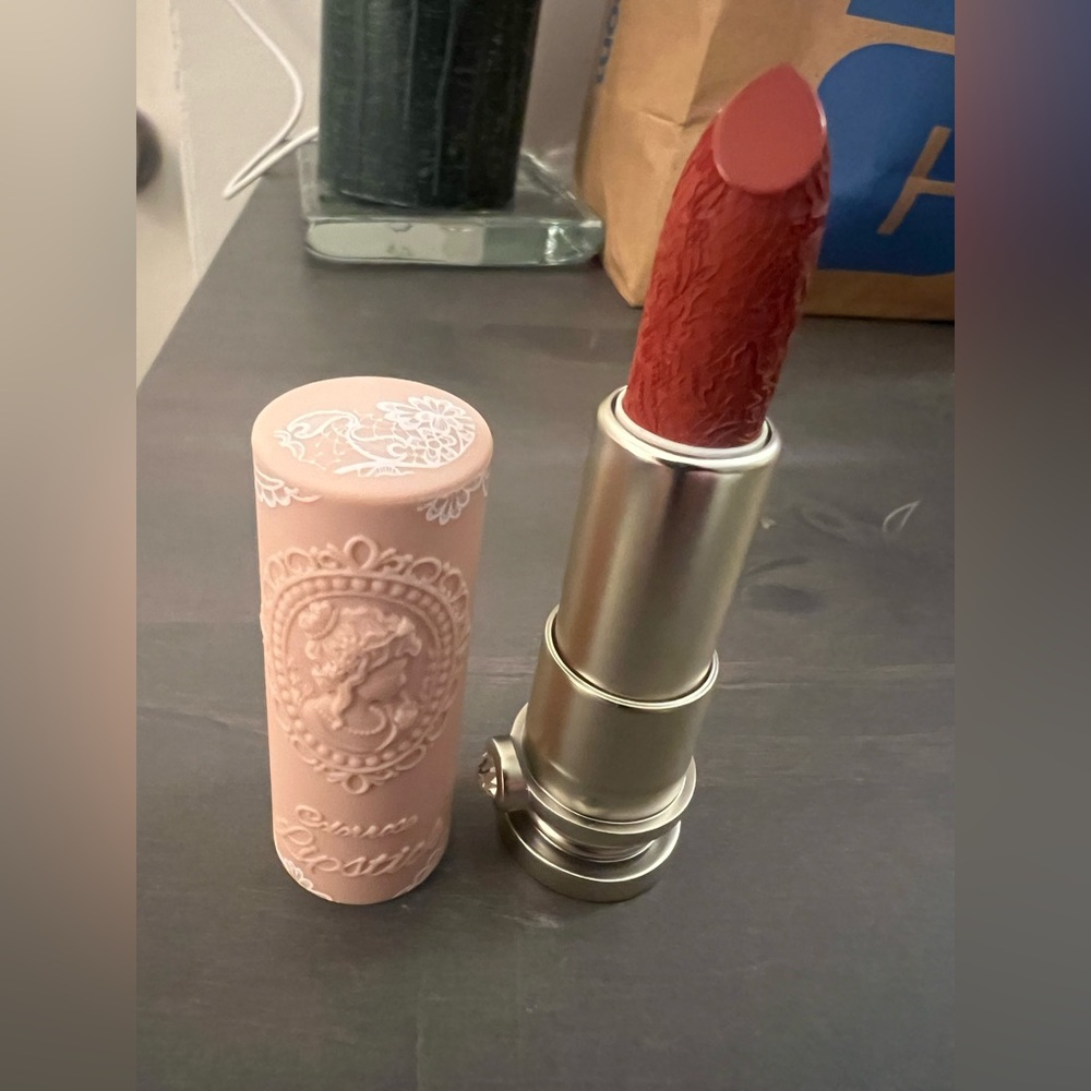 Elegant red Lipstick with Intricate Design